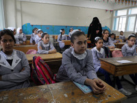 Palestinian students sit in a classroom at a United-Nations run school as a new school year begins as Palestinians ease the coronavirus dise...