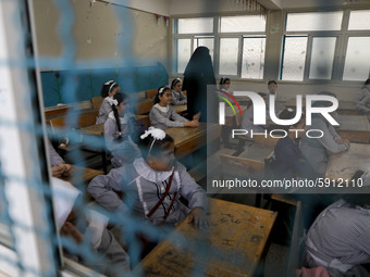 Palestinian students sit in a classroom at a United-Nations run school as a new school year begins as Palestinians ease the coronavirus dise...