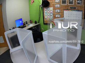 Desk shields are seen on a circular desk in a classroom at Layer Elementary School during a media preview a week before classes begin for th...