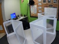 Desk shields are seen on a circular desk in a classroom at Layer Elementary School during a media preview a week before classes begin for th...