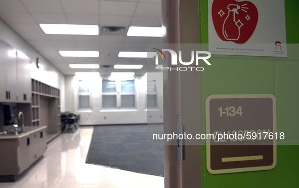 An empty classroom near the building exit which is designated as an isolation room for sick students is seen during a media preview at Layer...