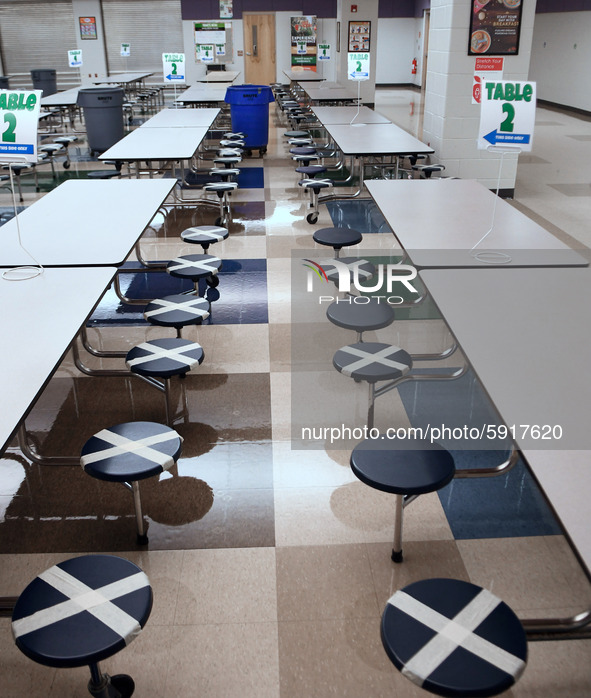 The cafeteria with seats designated to provide social distancing is seen at Layer Elementary School during a media preview a week before cla...