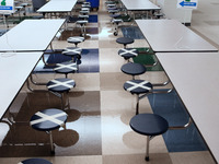 The cafeteria with seats designated to provide social distancing is seen at Layer Elementary School during a media preview a week before cla...