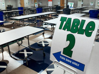 The cafeteria with seats designated to provide social distancing is seen at Layer Elementary School during a media preview a week before cla...