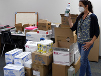 Kim Dove, Director of Facilities Services for Seminole County Public Schools, displays the sanitizing and disinfectant supplies and face mas...