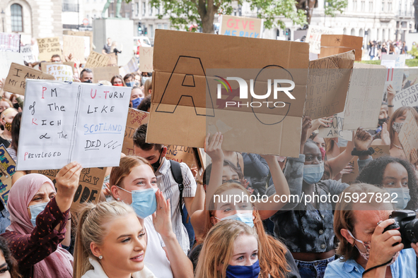 Youth protests at Parliament square against a new exam rating system which has been introduced in British education system - London, England...