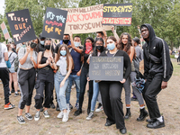 Youth protests at Parliament square against a new exam rating system which has been introduced in British education system - London, England...