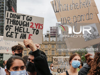 Youth protests at Parliament square against a new exam rating system which has been introduced in British education system - London, England...