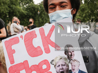 Youth protests at Parliament square against a new exam rating system which has been introduced in British education system - London, England...