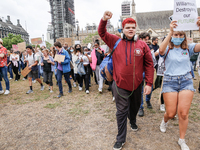 Youth protests at Parliament square against a new exam rating system which has been introduced in British education system - London, England...