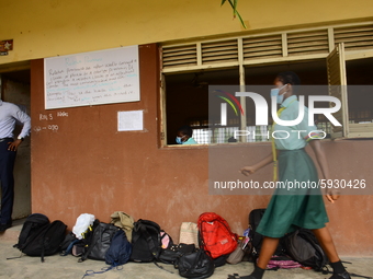 A final year students of Babs Fafunwa Millennium Senior Grammar School, Ojodu, Lagos, Nigeria, wearing a facemask leaves a classroom before...