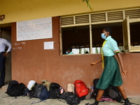 A final year students of Babs Fafunwa Millennium Senior Grammar School, Ojodu, Lagos, Nigeria, wearing a facemask leaves a classroom before...