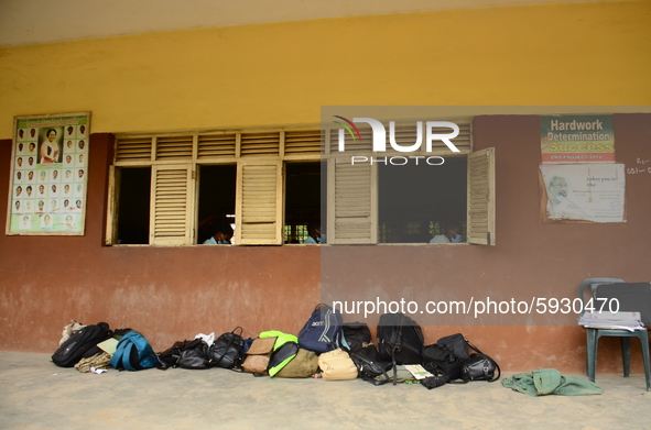 Final year students of Babs Fafunwa Millennium Senior Grammar School, Ojodu, Lagos, Nigeria, drop their bags outside their classroom as they...