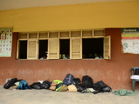 Final year students of Babs Fafunwa Millennium Senior Grammar School, Ojodu, Lagos, Nigeria, drop their bags outside their classroom as they...