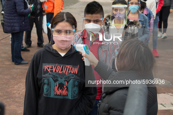 Before entering the University Olympic Stadium, undergraduate applicants had their body temperature measured and received antibacterial gel....