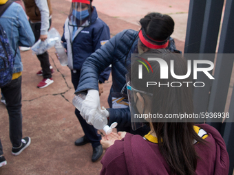 Before entering the University Olympic Stadium, undergraduate applicants had their body temperature measured and received antibacterial gel....