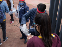 Before entering the University Olympic Stadium, undergraduate applicants had their body temperature measured and received antibacterial gel....