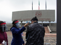 Before entering the University Olympic Stadium, undergraduate applicants had their body temperature measured and received antibacterial gel....