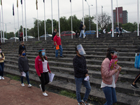 Aspiring graduates from UNAM, they await their entrance to the stadium to take their exam where they were asked to wear a mask, mask and res...