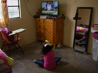 A student takes virtual classes and through the different television channels on August 24, 2020 in Mexico City, Mexico, during the new 2020...