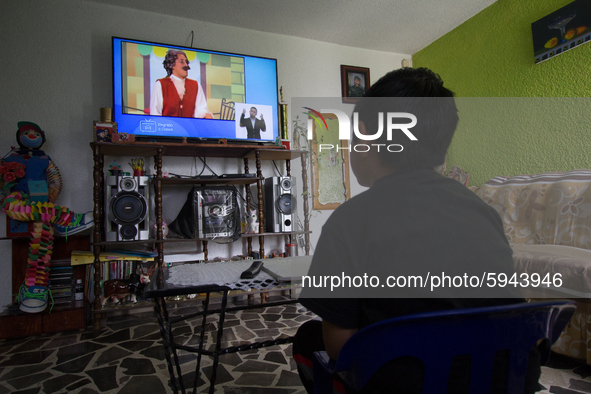 A student takes virtual classes and through the different television channels on August 24, 2020 in Mexico City, Mexico, during the new 2020...