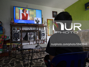 A student takes virtual classes and through the different television channels on August 24, 2020 in Mexico City, Mexico, during the new 2020...