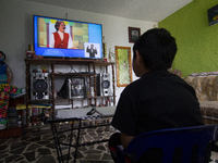 A student takes virtual classes and through the different television channels on August 24, 2020 in Mexico City, Mexico, during the new 2020...