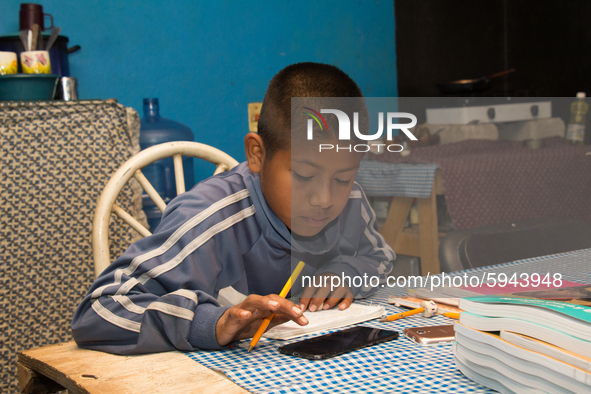 A student takes virtual classes and through the different television channels on August 24, 2020 in Mexico City, Mexico, during the new 2020...