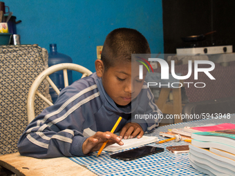 A student takes virtual classes and through the different television channels on August 24, 2020 in Mexico City, Mexico, during the new 2020...