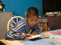 A student takes virtual classes and through the different television channels on August 24, 2020 in Mexico City, Mexico, during the new 2020...