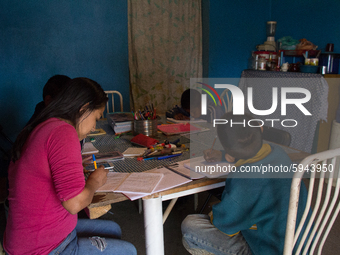 A student takes virtual classes and through the different television channels on August 24, 2020 in Mexico City, Mexico, during the new 2020...