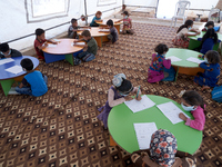 Syrian students take a math lesson in a refugee camp near Syrian-Turkish borders in Idlib, Syria, on August 25, 2020. (