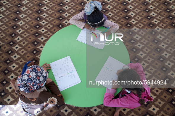 Syrian students take a math lesson in a refugee camp near Syrian-Turkish borders in Idlib, Syria, on August 25, 2020. 