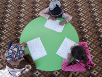 Syrian students take a math lesson in a refugee camp near Syrian-Turkish borders in Idlib, Syria, on August 25, 2020. (