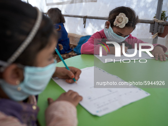 Syrian students take a math lesson in a refugee camp near Syrian-Turkish borders in Idlib, Syria, on August 25, 2020. (