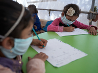 Syrian students take a math lesson in a refugee camp near Syrian-Turkish borders in Idlib, Syria, on August 25, 2020. (