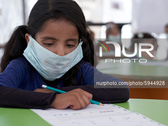 Syrian students take a math lesson in a refugee camp near Syrian-Turkish borders in Idlib, Syria, on August 25, 2020. (