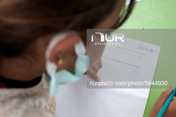 Syrian students take a math lesson in a refugee camp near Syrian-Turkish borders in Idlib, Syria, on August 25, 2020. 