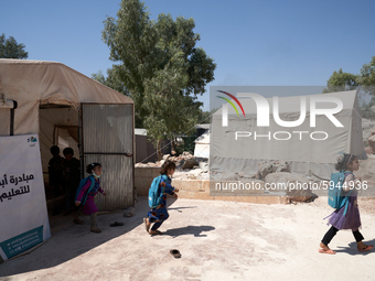 Syrian students leave the educational tent after taking a math lesson in a refugee camp near Syrian-Turkish borders in Idlib, Syria, on Augu...