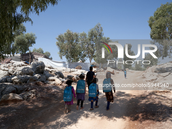 Syrian students leave the educational tent after taking a math lesson in a refugee camp near Syrian-Turkish borders in Idlib, Syria, on Augu...