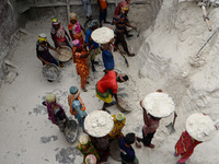 Day laborers unload sand from a cargo ship in Dhaka, Bangladesh on August 26, 2020. Dhaka is getting back to its normal life after months of...