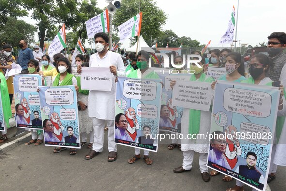 Students and Member of Trinamool Congress Chharta Parisad (TMCP) holds posters during a protest against the Union Government conducting JEE...