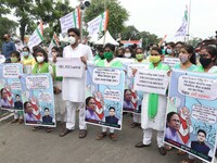 Students and Member of Trinamool Congress Chharta Parisad (TMCP) holds posters during a protest against the Union Government conducting JEE...