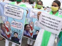 Students and Member of Trinamool Congress Chharta Parisad (TMCP) holds posters during a protest against the Union Government conducting JEE...