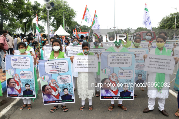 Students and Member of Trinamool Congress Chharta Parisad (TMCP) holds posters during a protest against the Union Government conducting JEE...