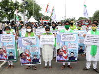 Students and Member of Trinamool Congress Chharta Parisad (TMCP) holds posters during a protest against the Union Government conducting JEE...