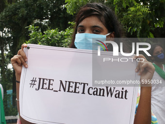 Students and Member of Trinamool Congress Chharta Parisad (TMCP) holds posters during a protest against the Union Government conducting JEE...