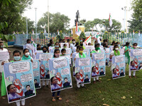 Students and Member of Trinamool Congress Chharta Parisad (TMCP) holds posters during a protest against the Union Government conducting JEE...