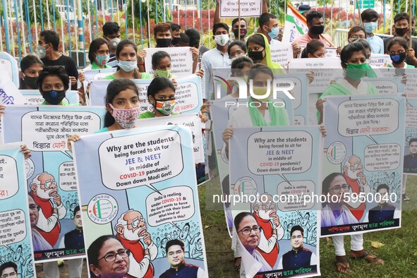 Students and Member of Trinamool Congress Chharta Parisad (TMCP) holds posters during a protest against the Union Government conducting JEE...