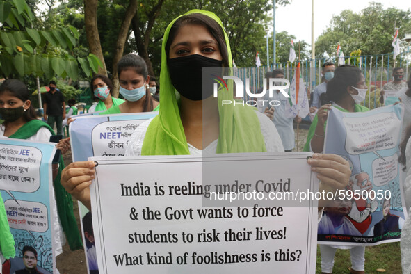 Students and Member of Trinamool Congress Chharta Parisad (TMCP) holds posters during a protest against the Union Government conducting JEE...